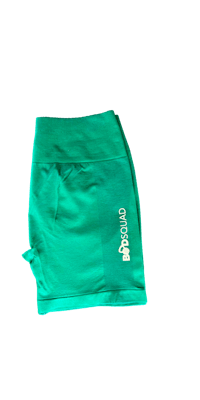 a green short with a white logo on it